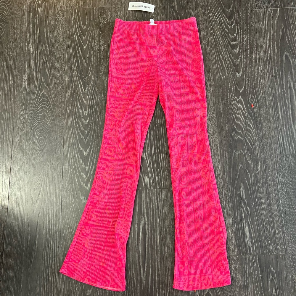 slim flare bright pink urban outfitters pants with cute hippie design